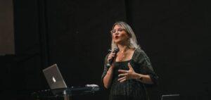 Woman speaking on stage