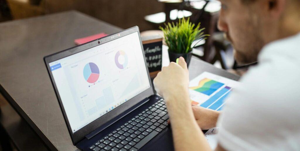 A_Man_Watching_Dashboard_on_Laptop A_Man_Watching_Dashboard_on_Laptop