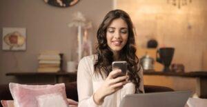 Woman-Looking-at-The-Phone-with-Happy-Face