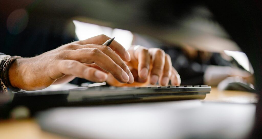 A_Man_Typing_Prompt_on_Computer
