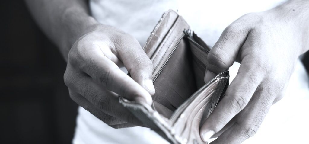 A_Man_Holding_Empty_Wallet