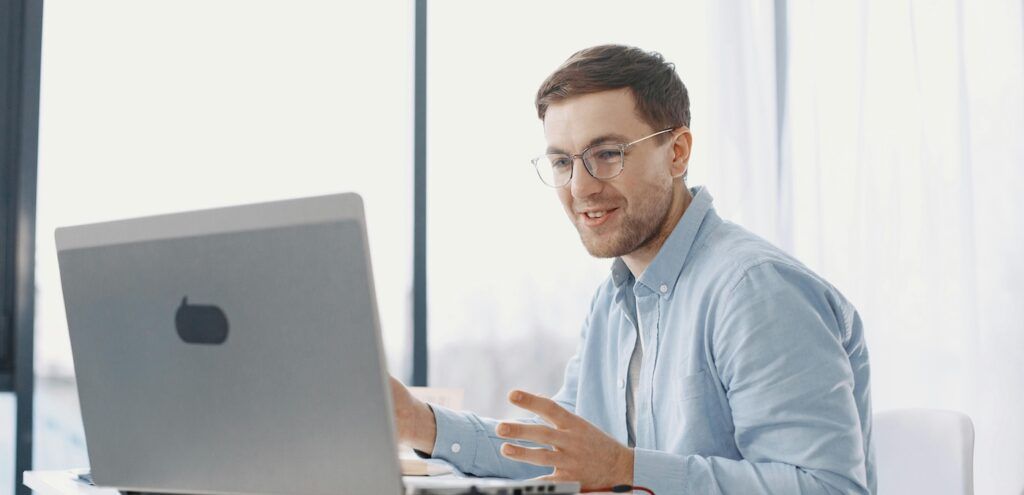 A_Man_Using_Laptop_in_Office