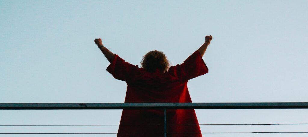 A_Standing_Woman_with_Her_Hands_Raised