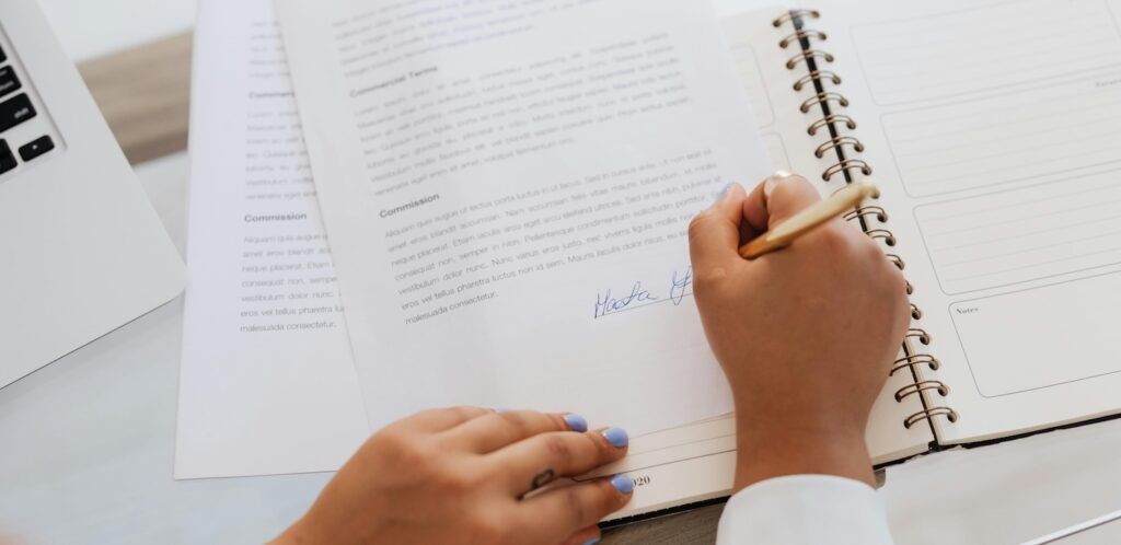 A_Woman_Signing_Contract A_Woman_Signing_Contract