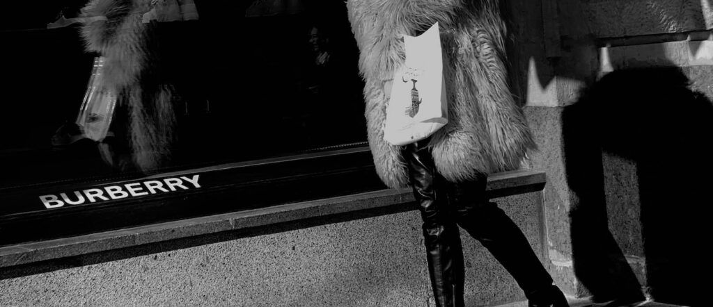 A_Woman_Walking_in_front_of_Burberry