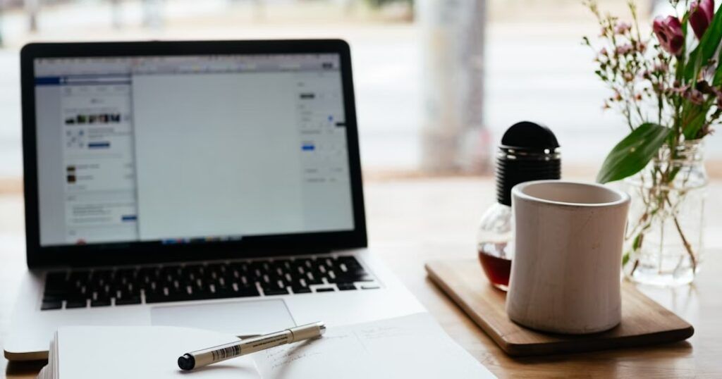 An_Opened_Book_with_Laptop