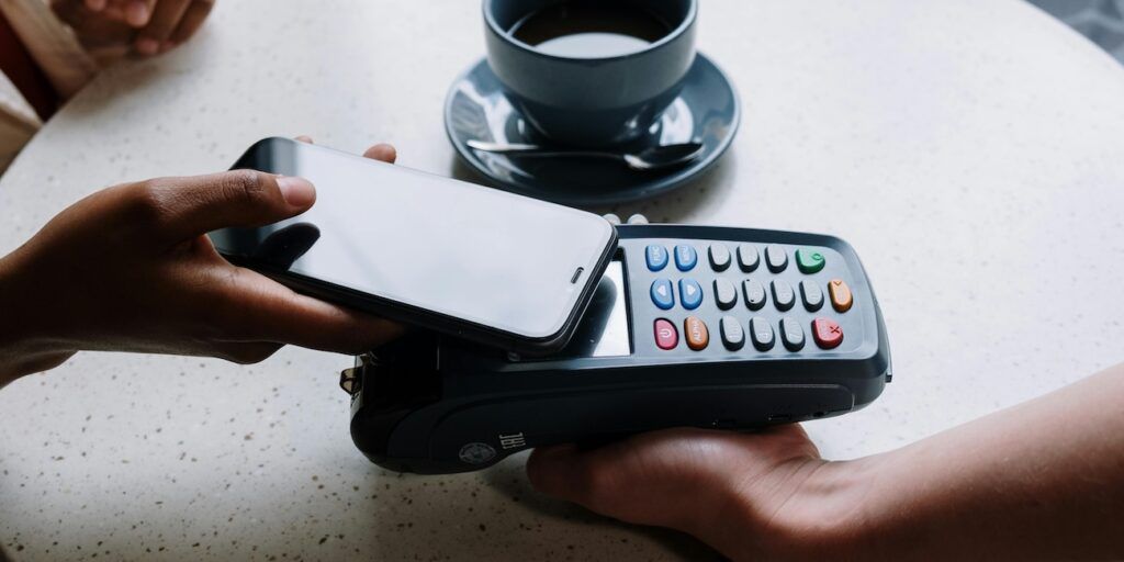 A_Woman_Paying_Via_QR_Scan A_Woman_Paying_Via_QR_Scan