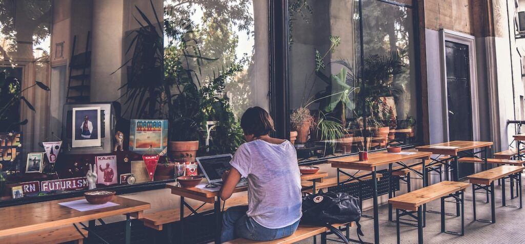 Woman_Sitting_Outside_Coffee_Shop