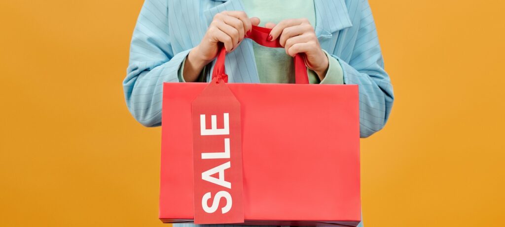 A Woman Holding a Shopping Bag A Woman Holding a Shopping Bag