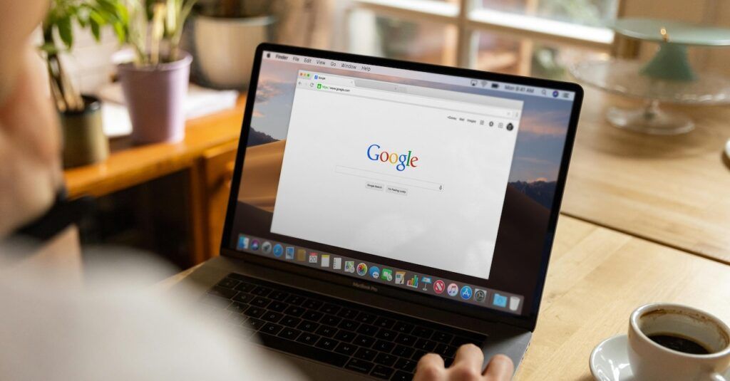 A Person Using a Laptop Searching Google