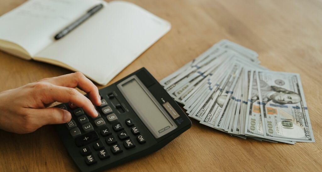 A_Man_Using_Calculator A_Man_Using_Calculator