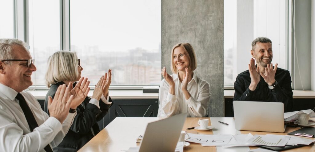Employees_Clapping_for_Business_Success Employees_Clapping_for_Business_Success