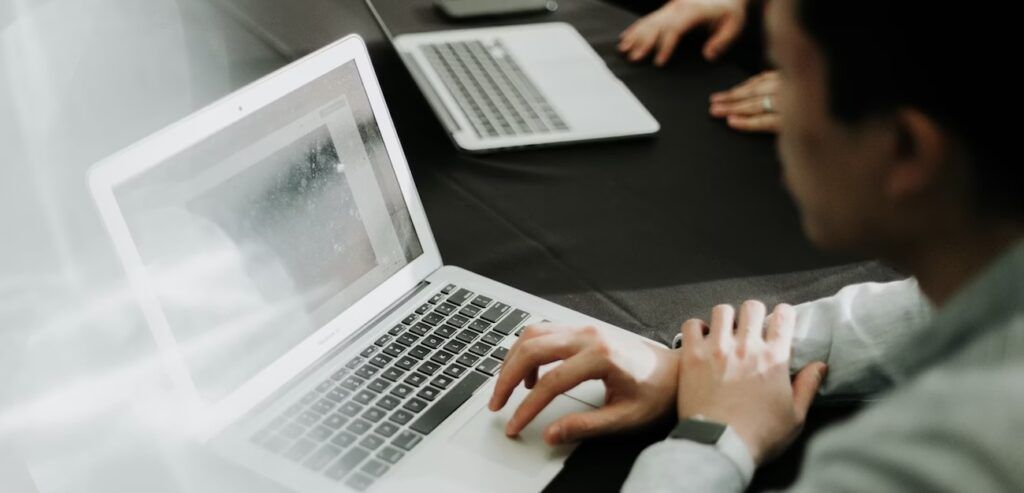 A_Man_Using_Laptop_in_Meeting_Room