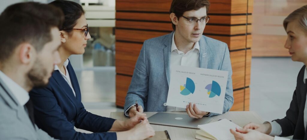 Business Team Analyzing Sales Data in Meeting