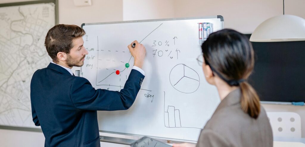 a-man-writing-on-whiteboard