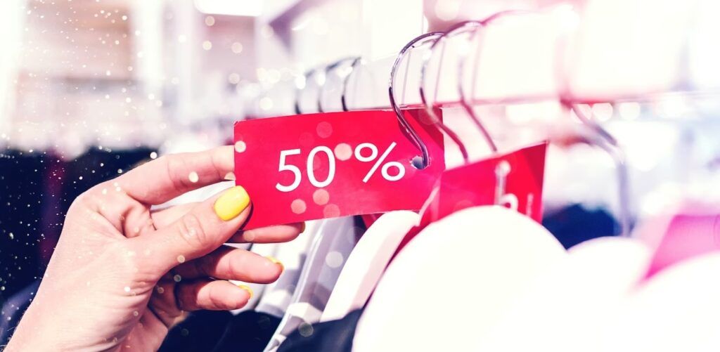 a-woman-holding-discount-tag