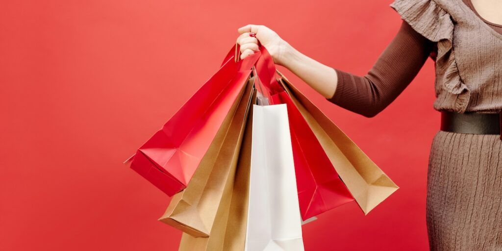 a-woman-holding-shopping-bags a-woman-holding-shopping-bags