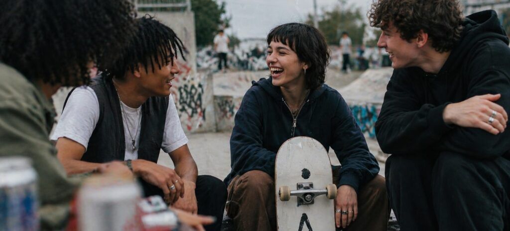 friends-happy-together-while-playing-at-skatepark