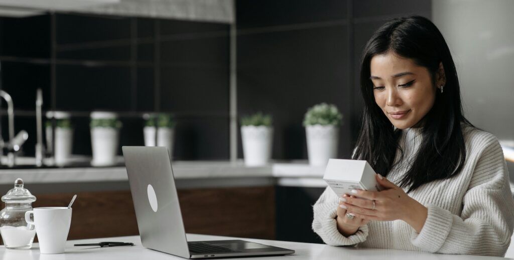 woman-looking-at-white-box