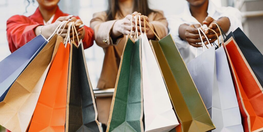 women-holding-many-shopping-bags women-holding-many-shopping-bags