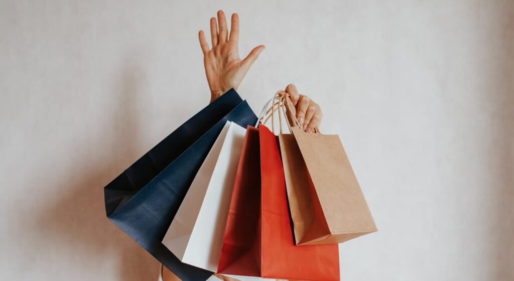 woman holding in hand shopping package