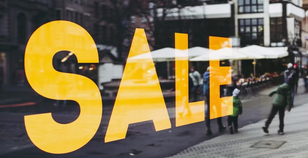 Sale signage on shop mirror