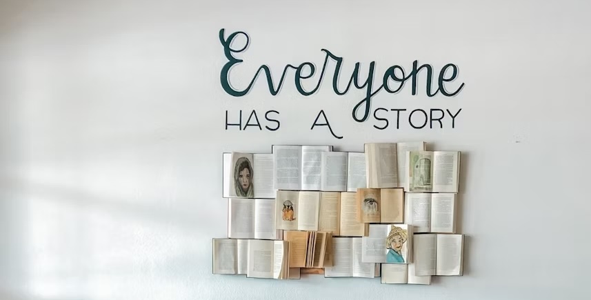 everyone has a story sign on the wall