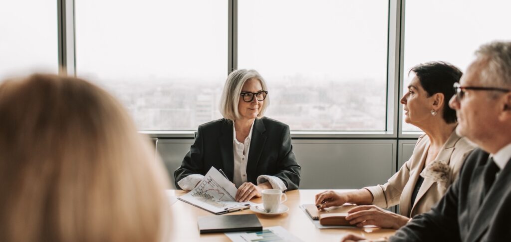 A group of professionals engaged in a business meeting