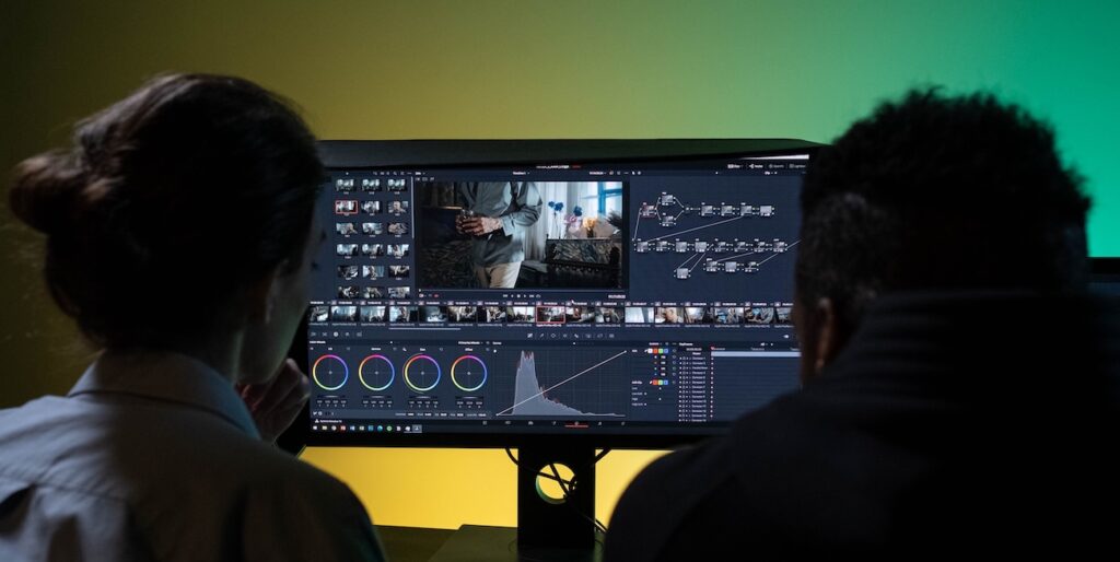 Team of two professionals video editing