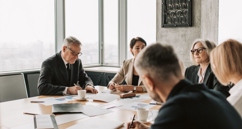 a collaborative meeting around a conference table