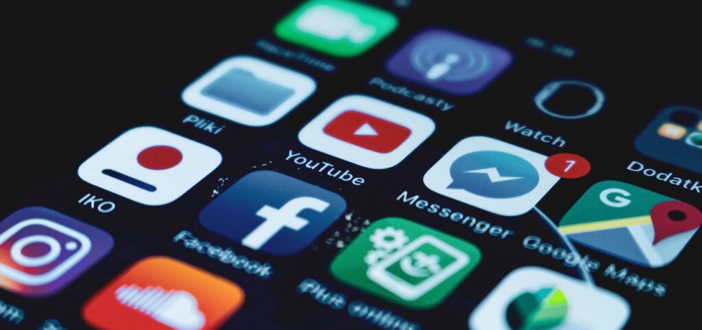 close-up view of a smartphone screen displaying various popular social media app icons close-up view of a smartphone screen displaying various popular social media app icons