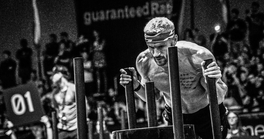 Pro-Athlete-pushing-the-HYROX-sled Pro-Athlete-pushing-the-HYROX-sled