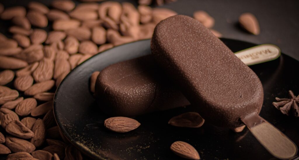 Rich almond and chocolate ice cream bars on a dark plate